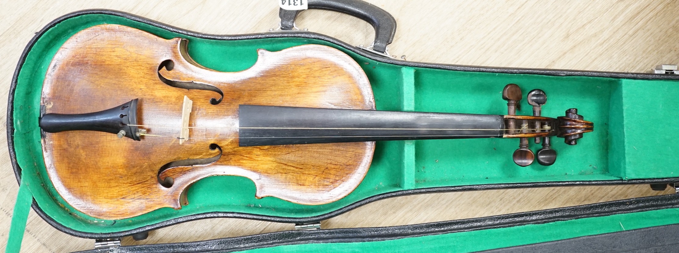 A cased violin. Label inside reads Copie de Pietro Antonius Dallas Costa fec in Treviso anno 17